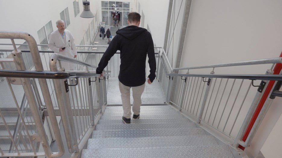 Senior neurologist and professor Peter Andersen is observing his ALS patient walking down the stairs at University Hospital of Northern Sweden.