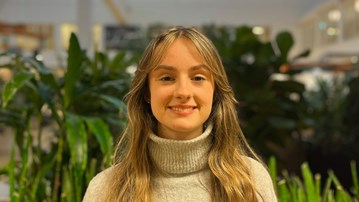 Exchange student standing in the University Library