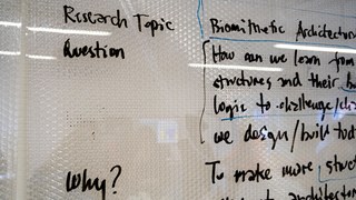 Whiteboard with text about Research