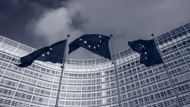 Flags of the European Union in front of the EU-commission building "Berlaymont" in Brussels, Belgium