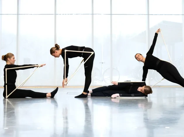 Four female students doing choreographed performance