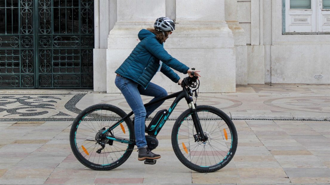 Photo of man on a bike with the product.